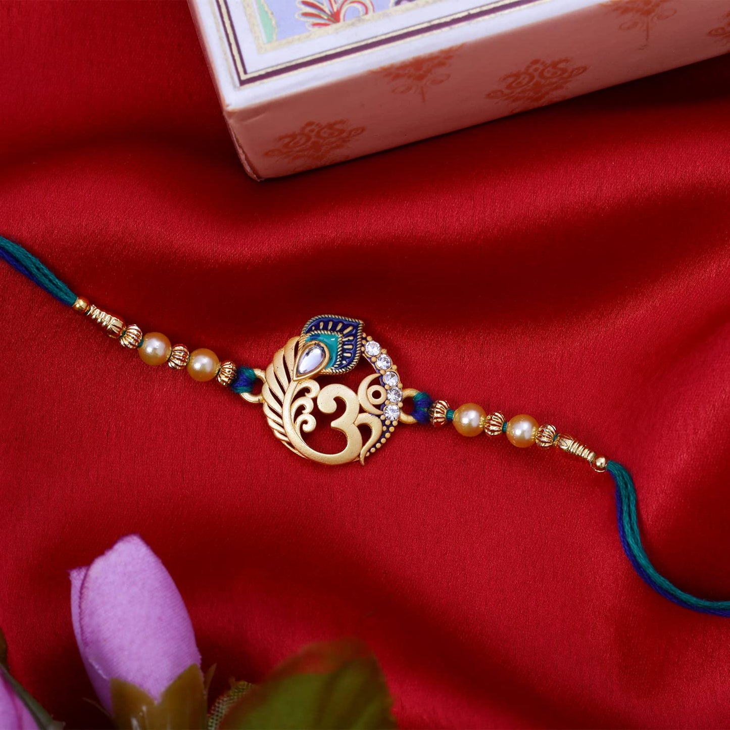 Riddhika Ventures Religious Meenakari Om and Peacock Feather Rakhi With Roli Chawal And Greeting Card