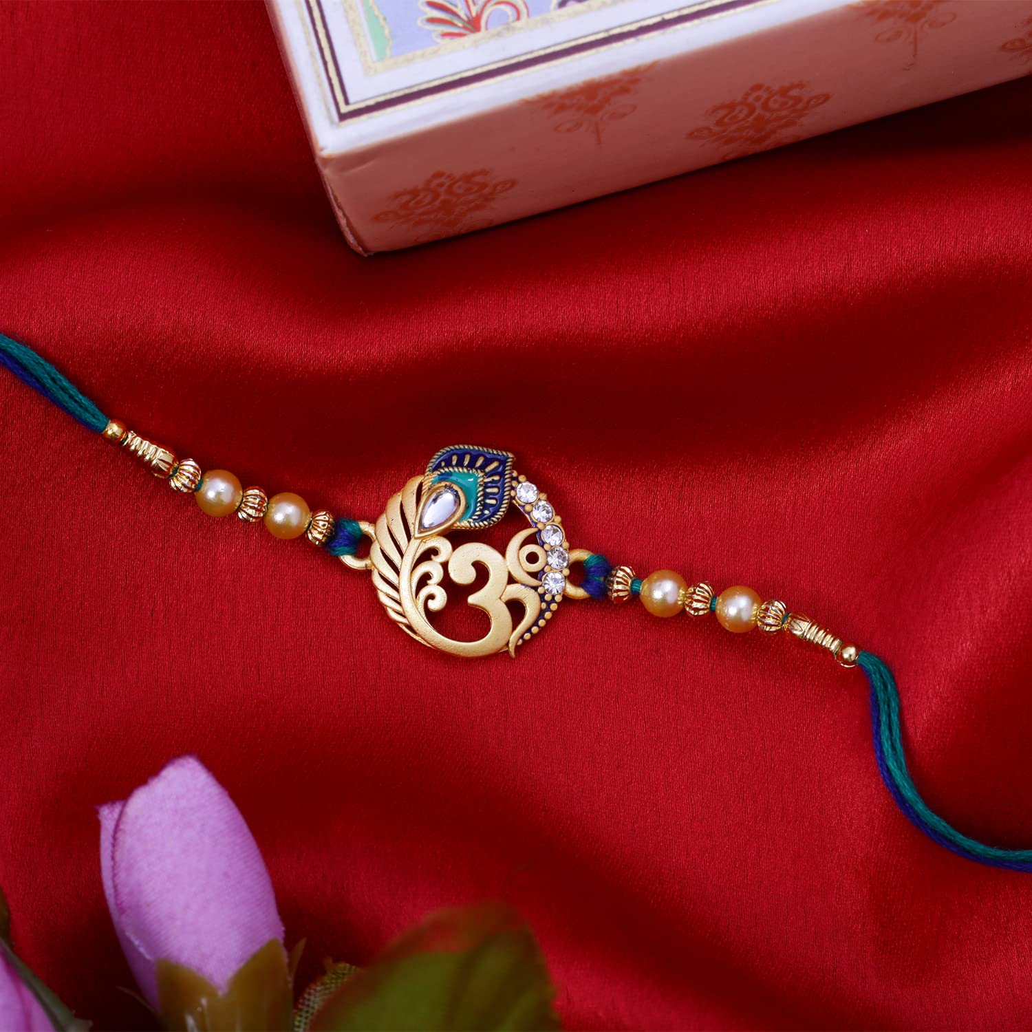 Riddhika Ventures Religious Meenakari Om and Peacock Feather Rakhi With Roli Chawal And Greeting Card